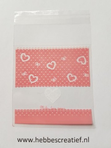 Zakje folie roze en strik en hart